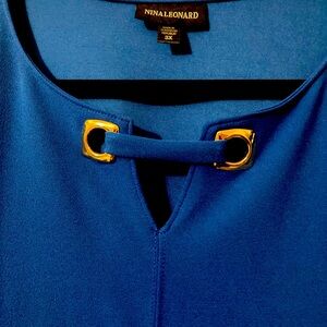 Stunning Nina Leonard dress with side pockets.